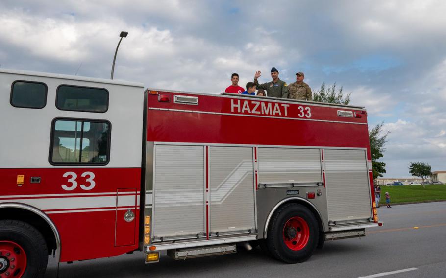 U.S. Air Force Colonel Robert Arnett, left, 18th Wing deputy commander, and Chief Master Sgt. William Cupp, 18th Wing command chief, participate in the 2025 Veterans Day Parade at Kadena Air Base.